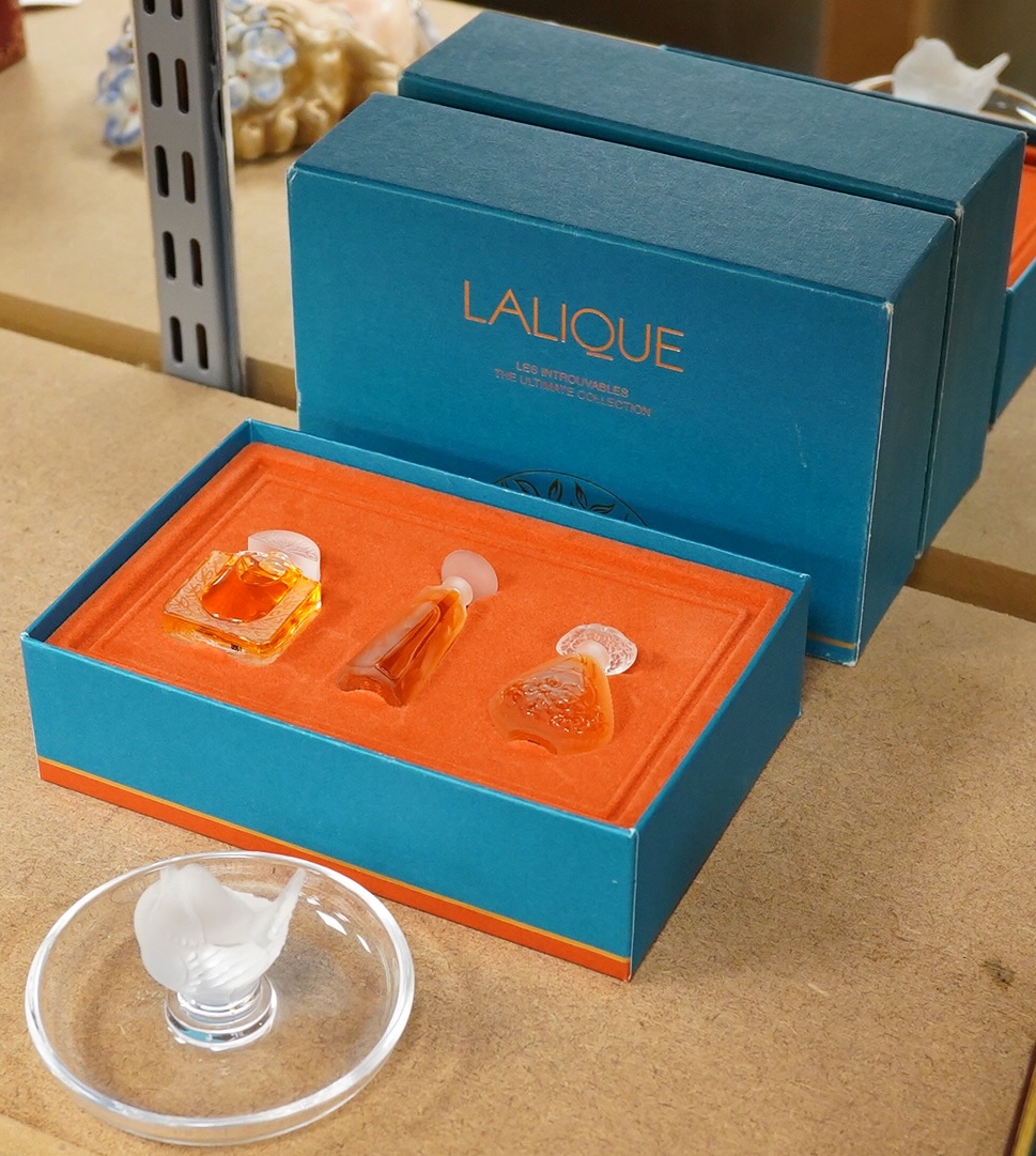 A Lalique bird pin dish and a Lalique perfume trio, Les Introuvables, in original box, pin dish 9cm